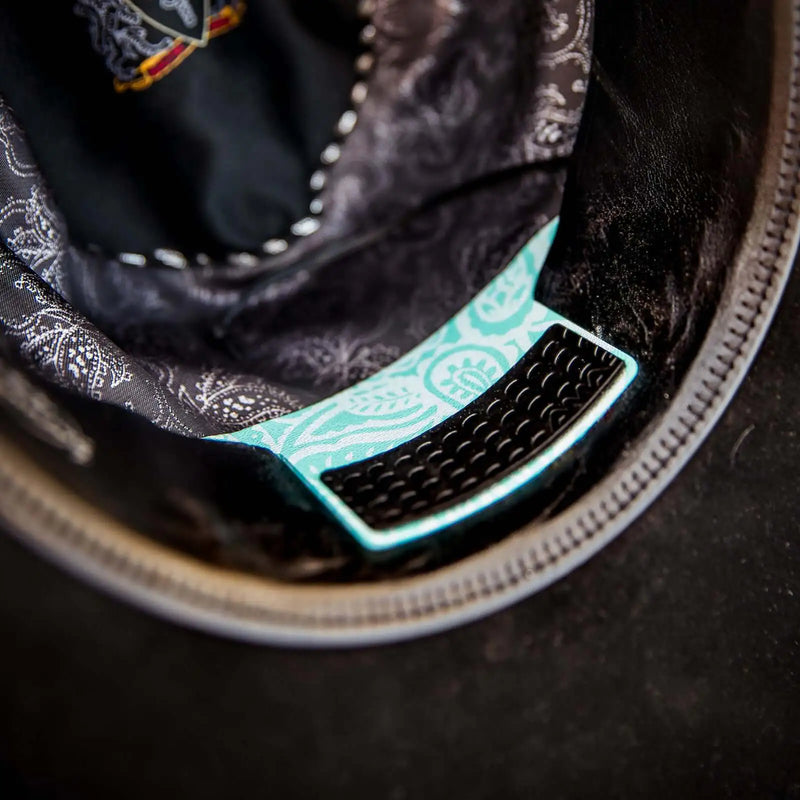 Twist of Teal Hat Cinch installed in a black felt cowboy hat