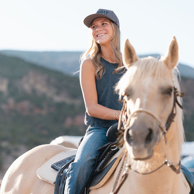 rider wearing the maverick cap in charcoal